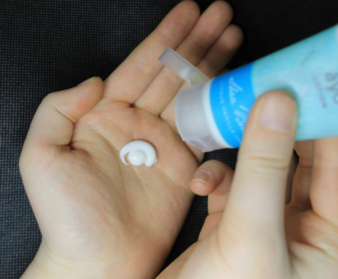 Cream squeezed from a tube into an open palm