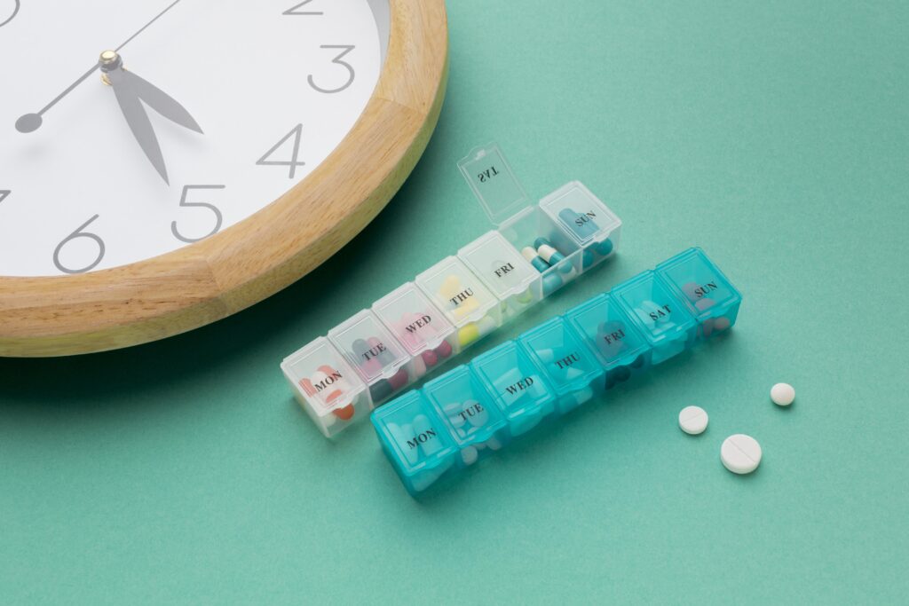 Using pill organizer and medication tracker for medication adherence